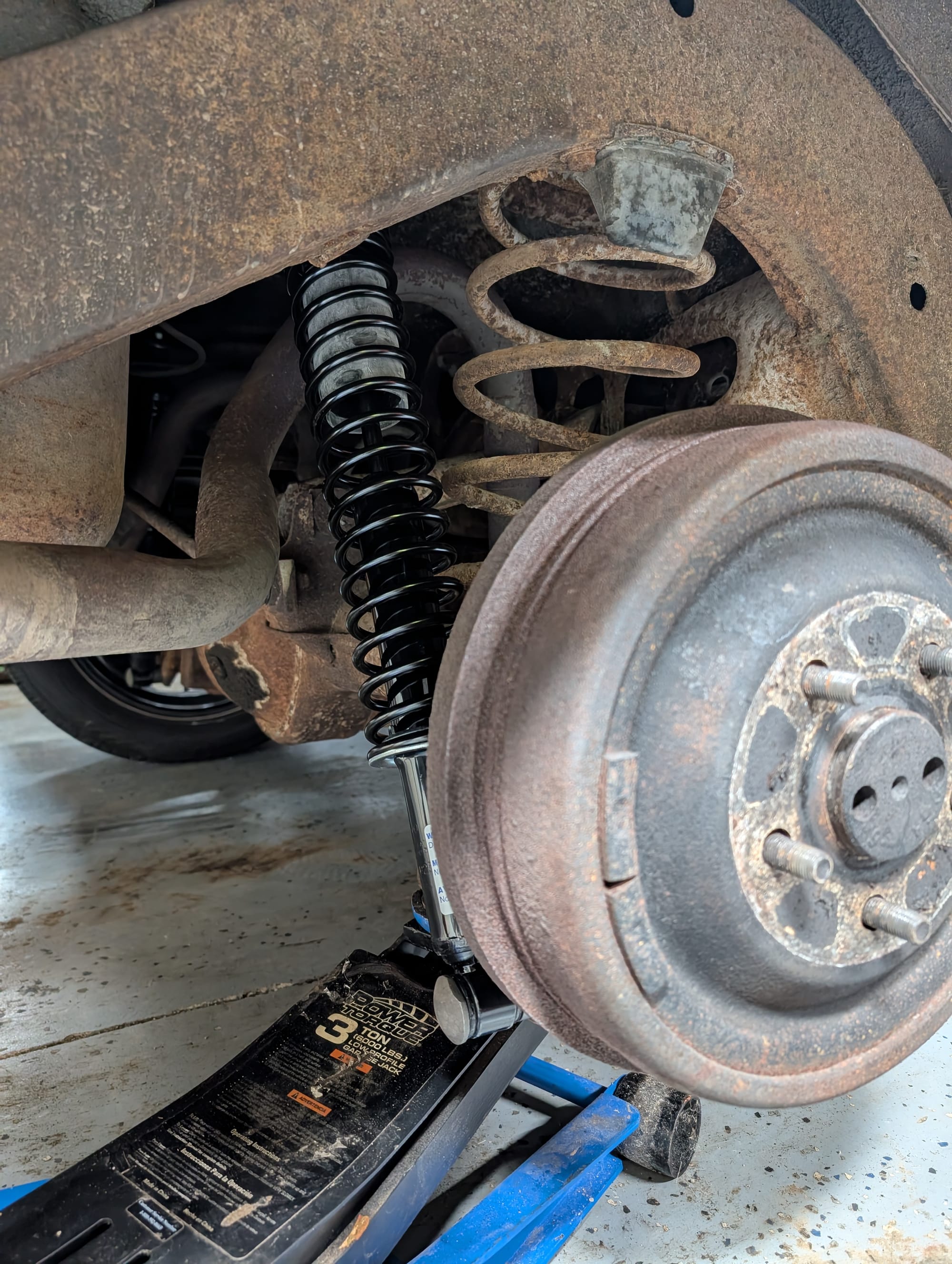 Me installing stiffer shocks on the galaxie while the 60 year old springs beg to be put out of their missery ☠️