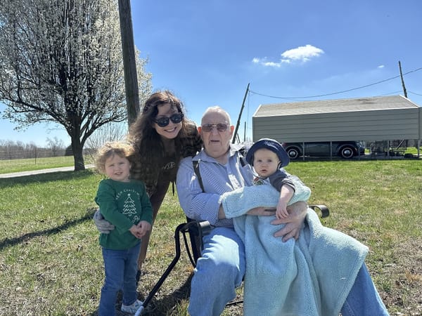 Helping Great Grandpa Frank clean up his flower beds